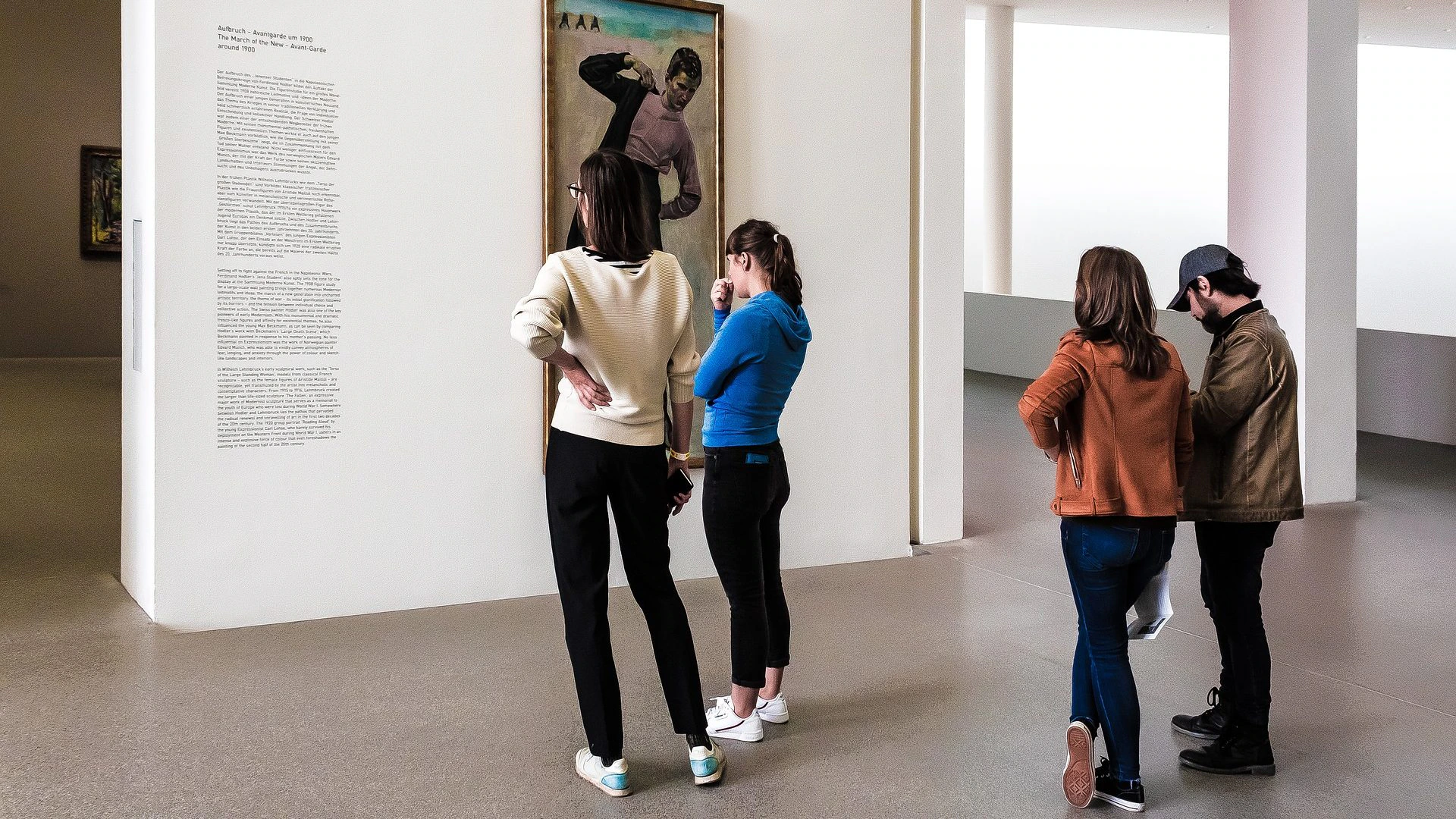 People look at a display in a museum