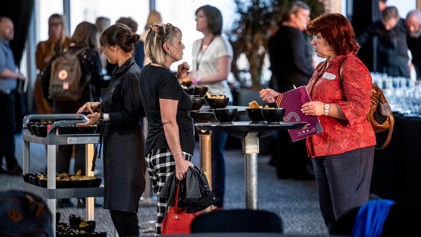 People socialising at a conference