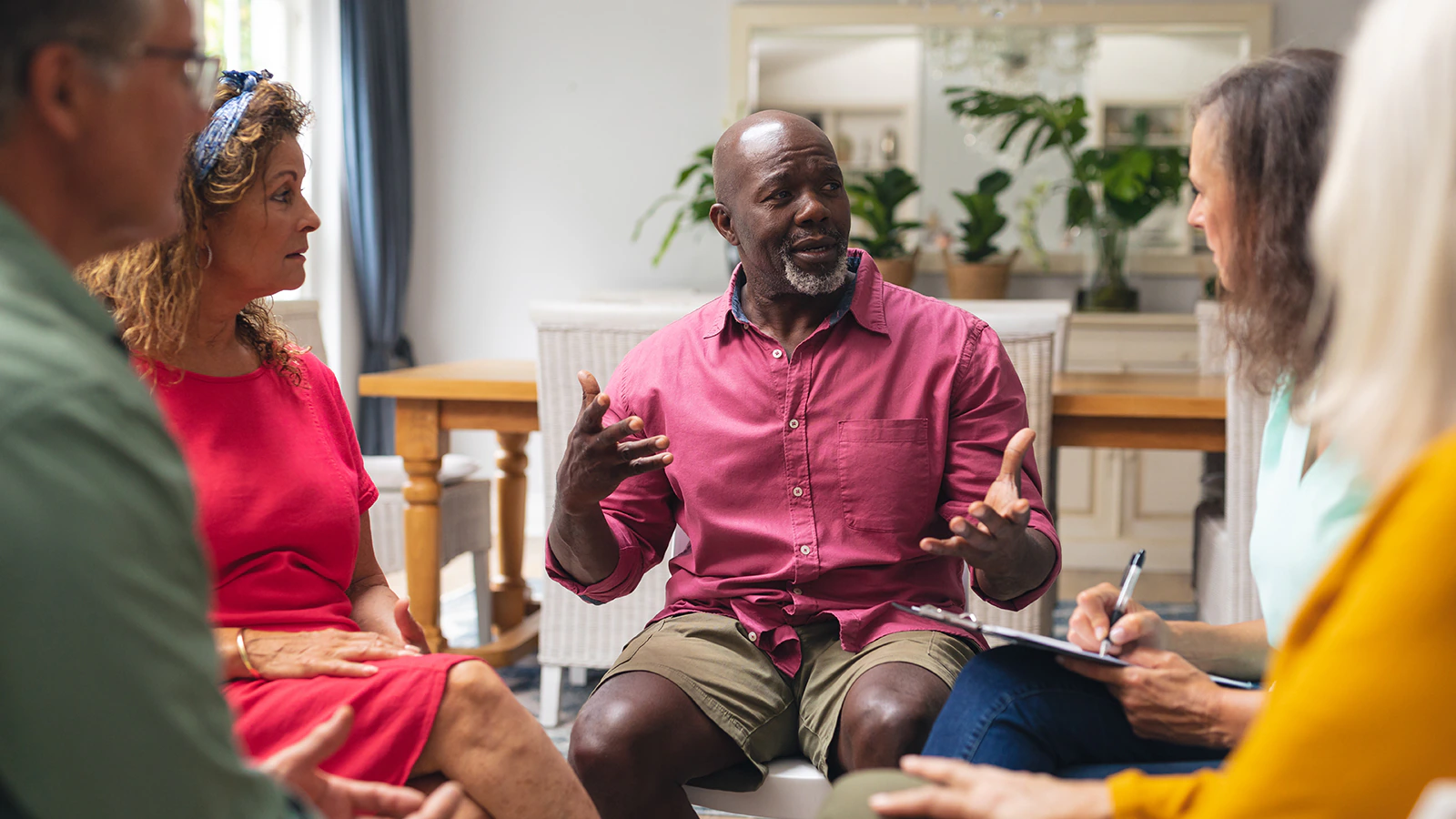 A group of people sits together and talks