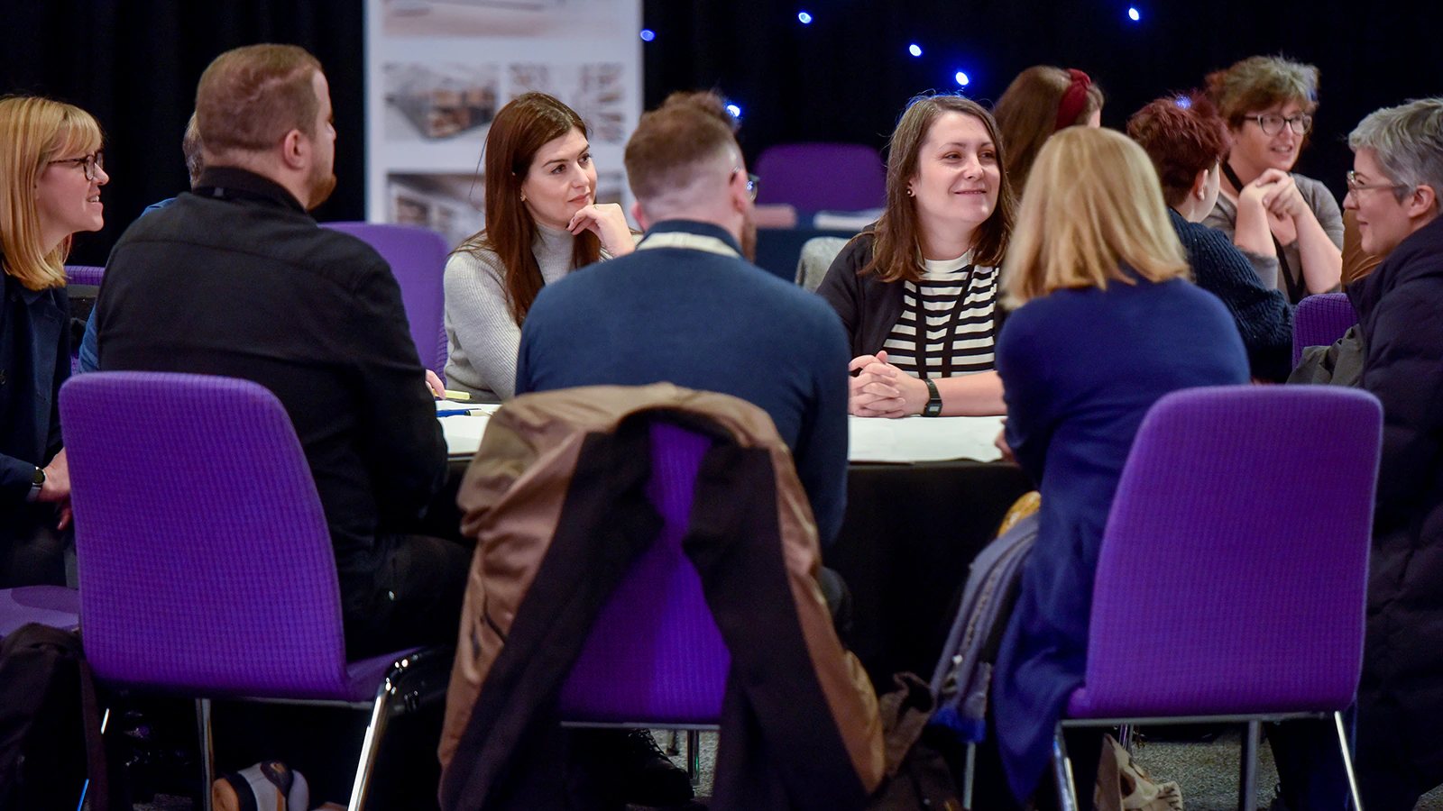 People sitting and talking at a table