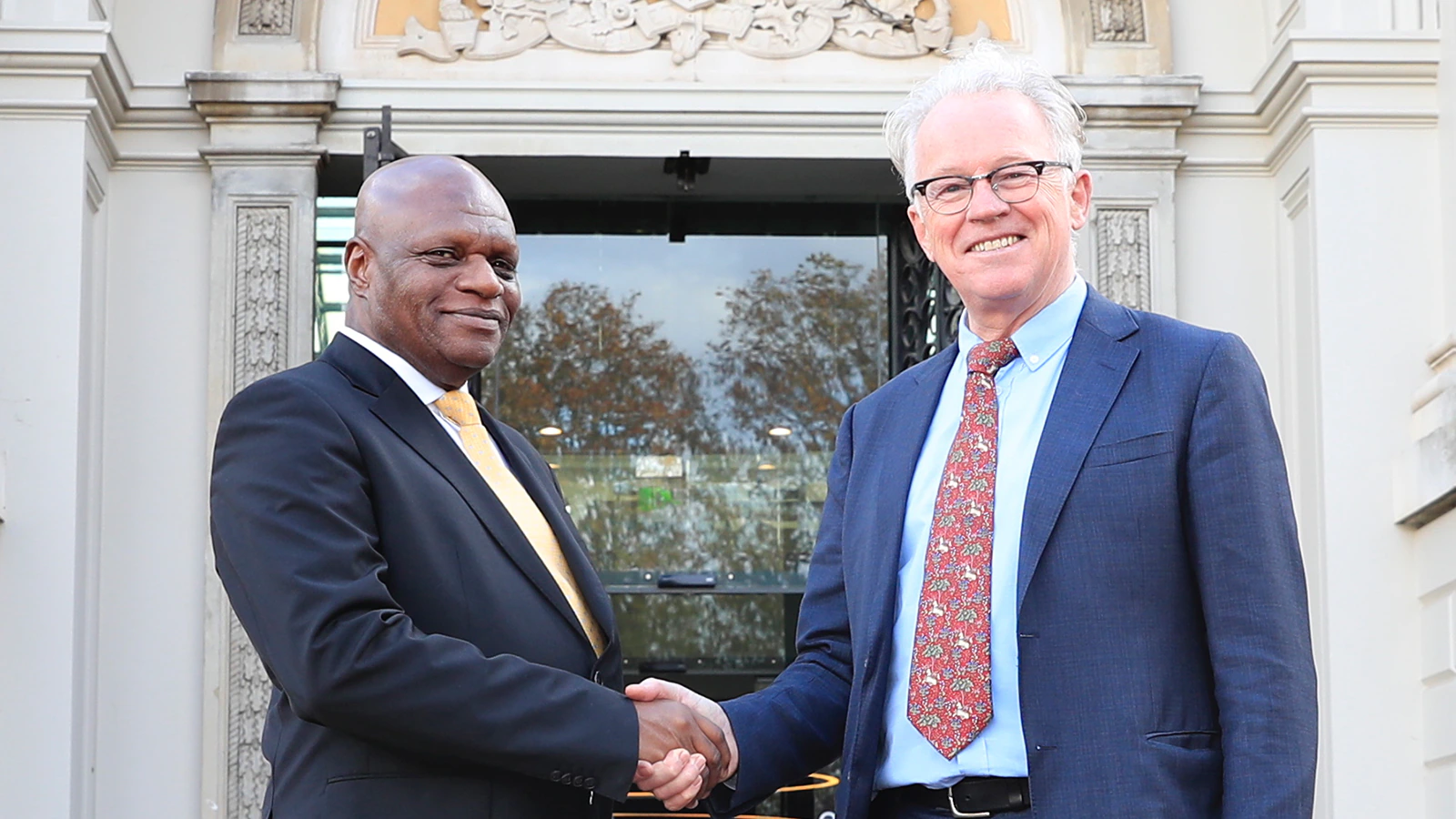 Two men meet and shake hands