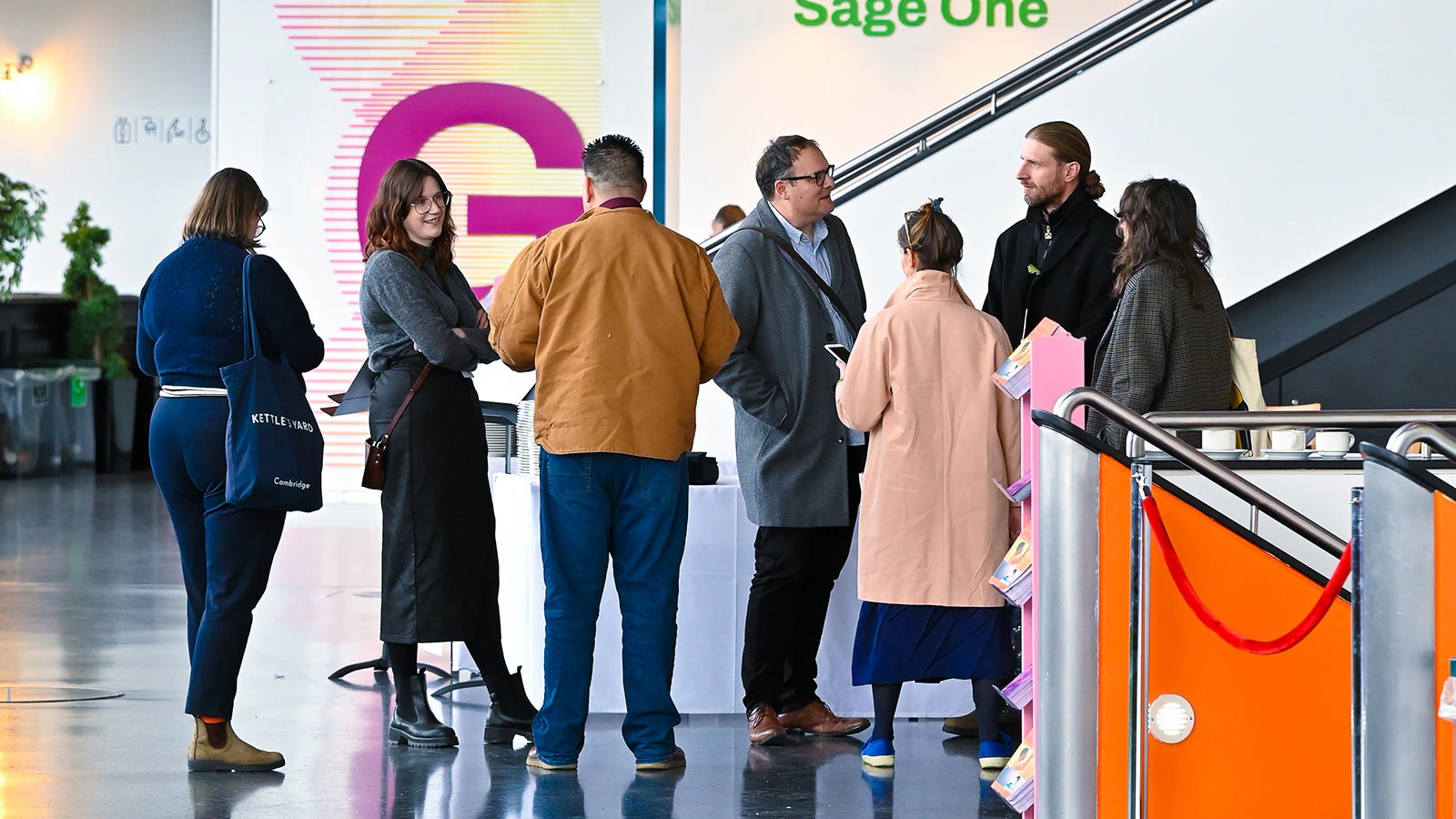 People socialise at a conference