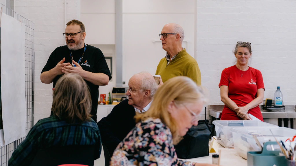 People take part in a workshop at the Amelia Scott
