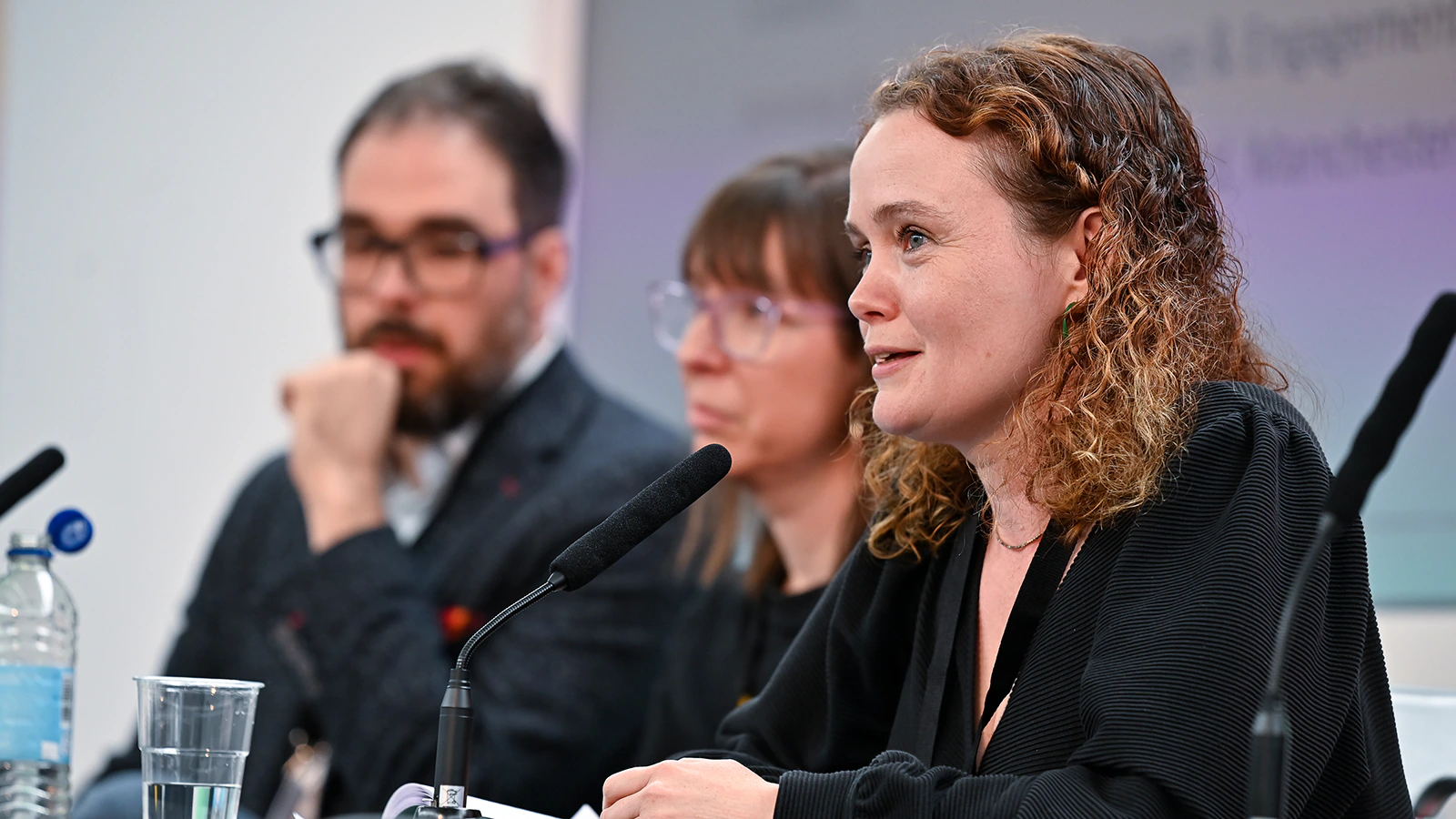 A person speaks on a panel at an MA conference
