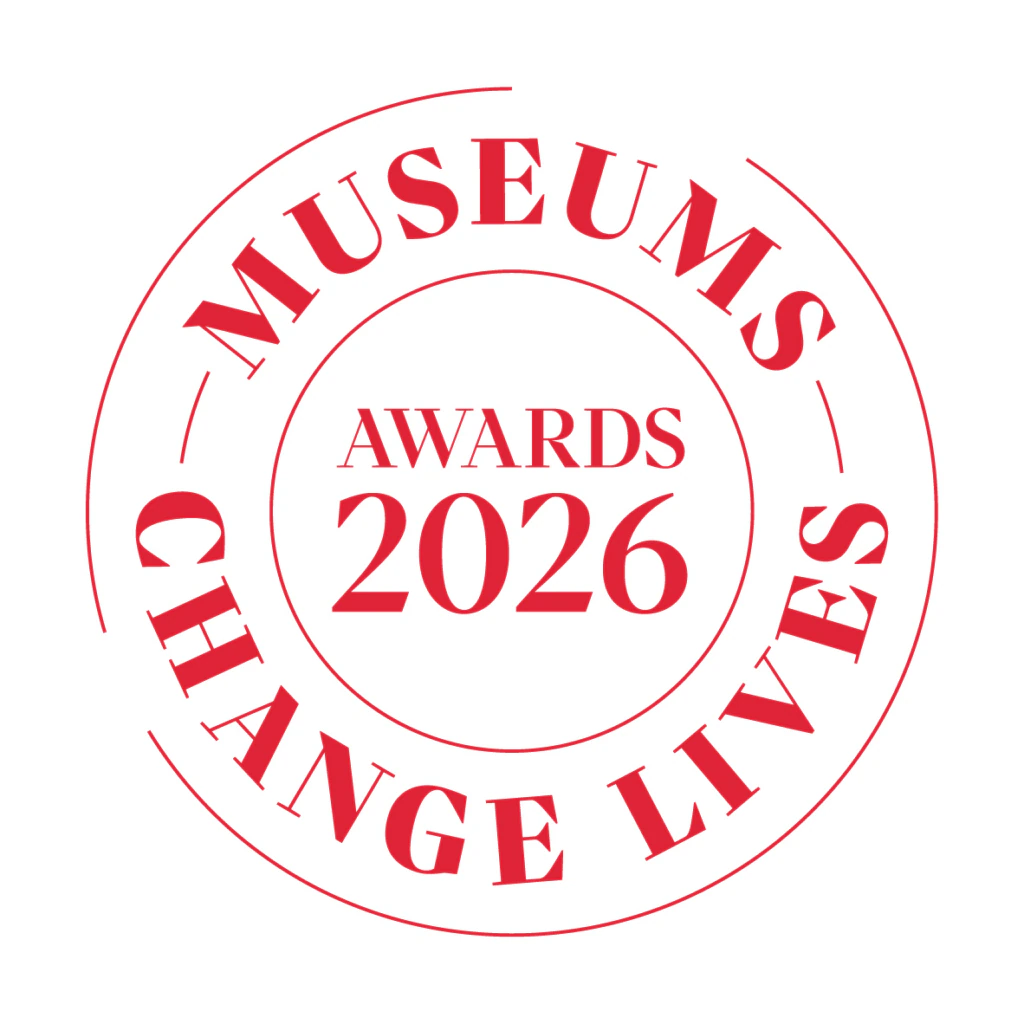 A red circular logo with the words “MUSEUMS CHANGE LIVES” around the edge and “AWARDS 2026” in the center.