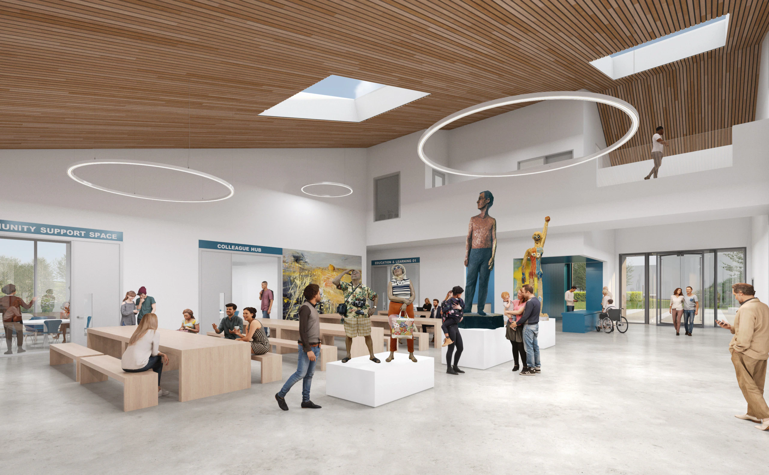 A spacious, modern lobby with wooden ceiling panels, circular light fixtures, people socializing, sitting, and viewing artwork. Large windows let in natural light, and sculptures are displayed in the center of the room.