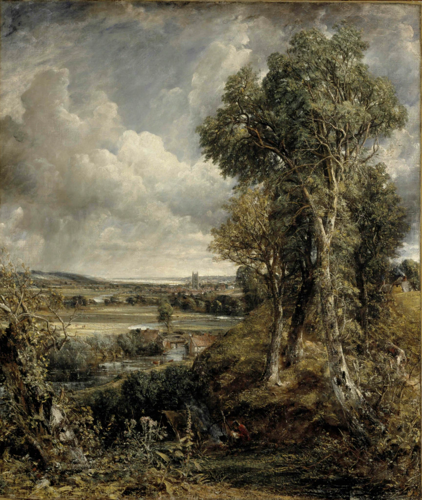 View of a lush, green countryside with tall trees in the foreground, fields, and a river. A cathedral stands in the distant background under a cloudy, dramatic sky.