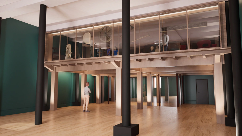 A person stands in a spacious gallery with wooden floors, looking up at a glass-walled mezzanine displaying artifacts, sculptures, and various objects above.