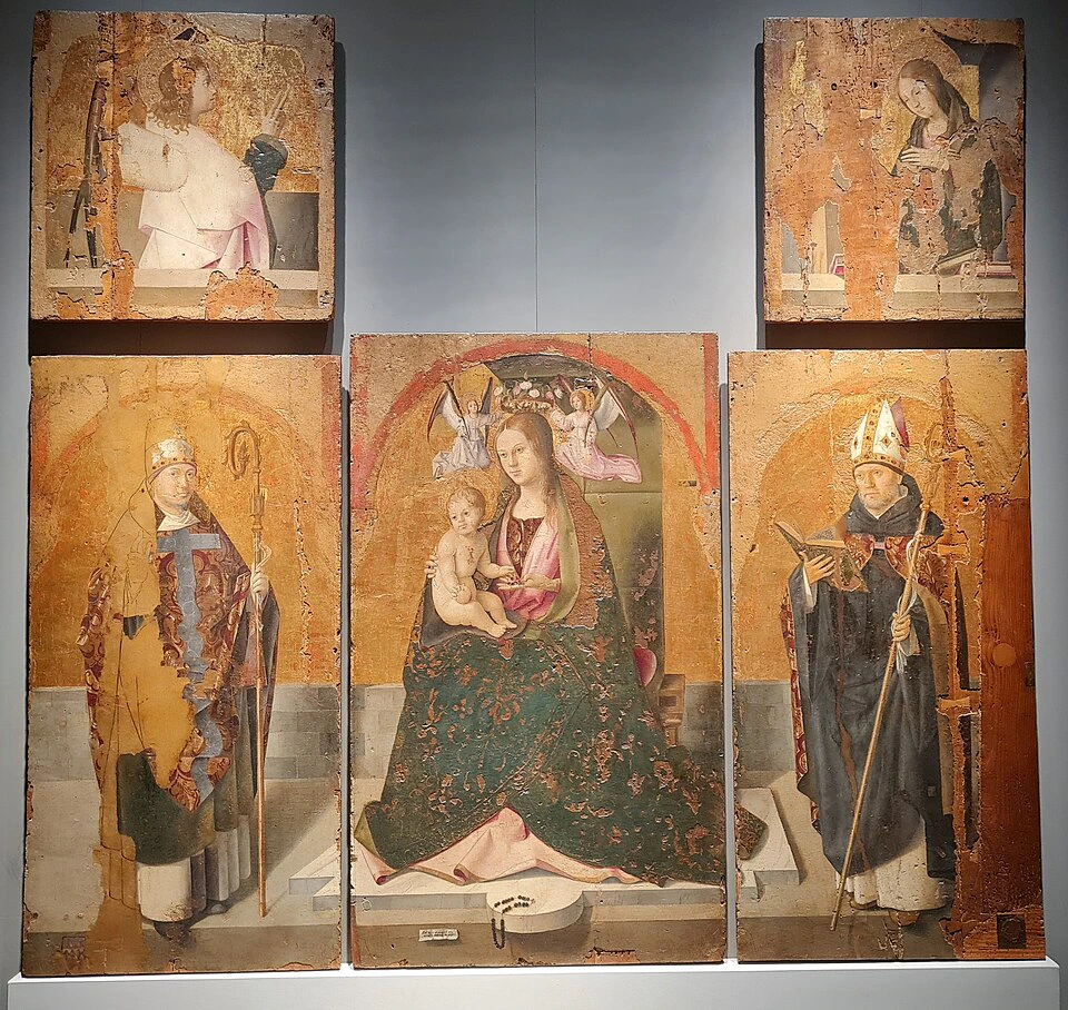 Five-panel religious artwork with faded colors, showing the Virgin Mary holding baby Jesus in the center, flanked by two saints in bishop attire, and two smaller saints above, all with worn and damaged surfaces.