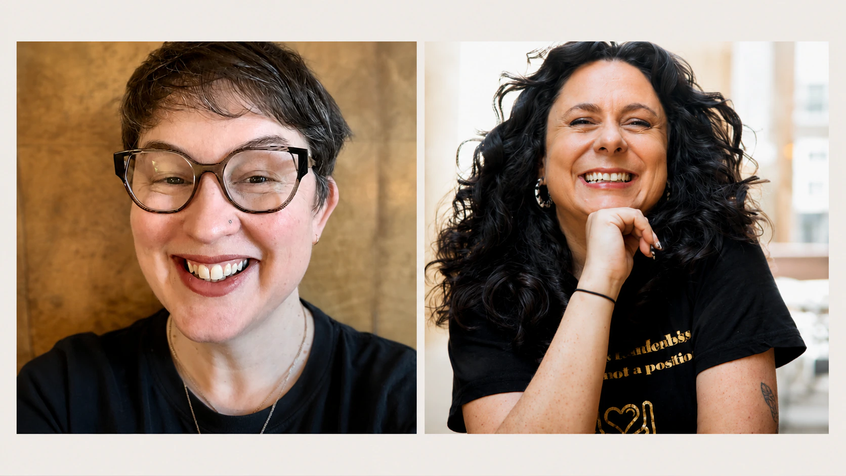 Two women smiling: the first has short brown hair, glasses, and a nose ring; the second has long curly dark hair, resting her chin on her hand. Both wear black shirts and appear cheerful.