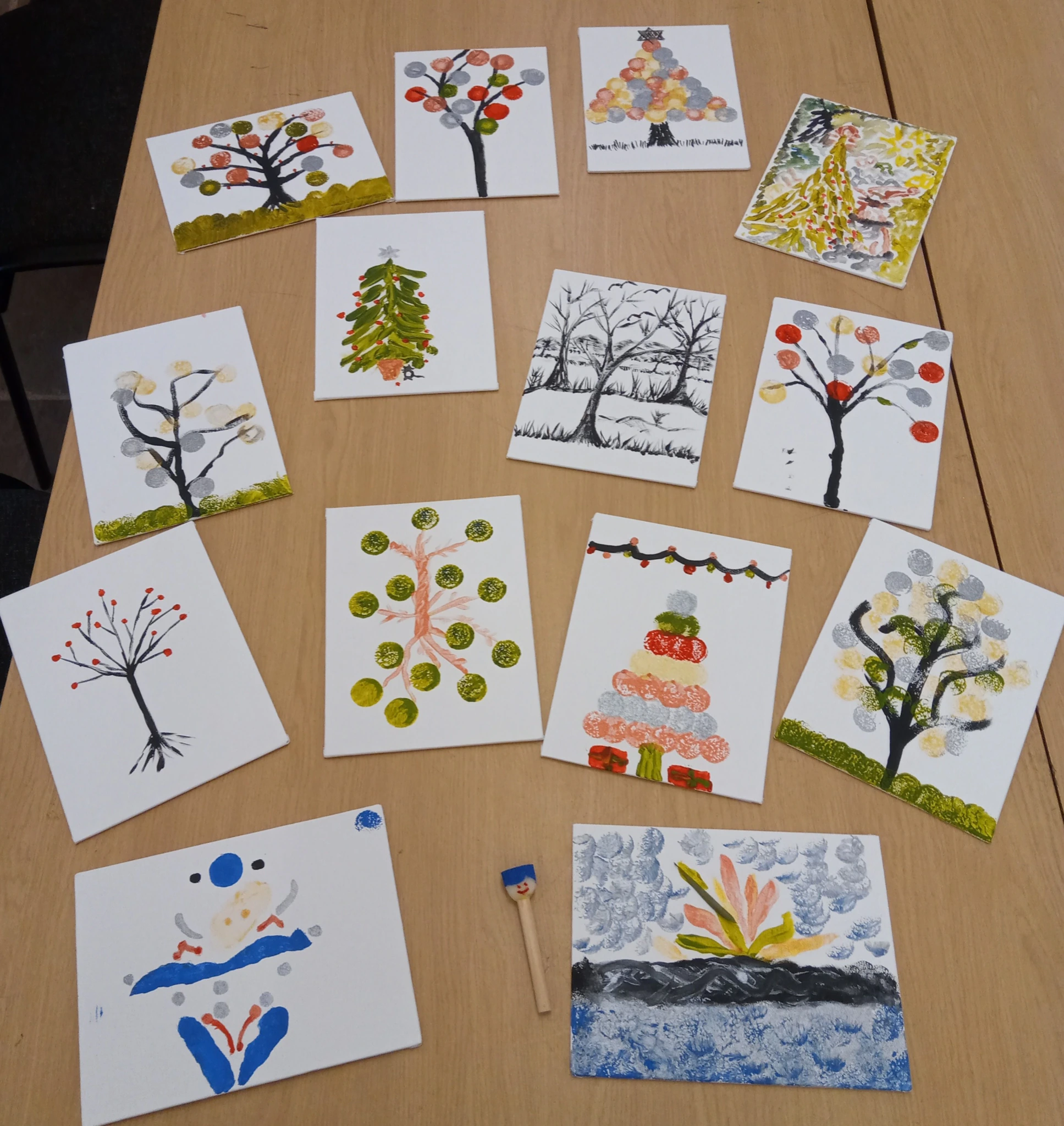 Watercolour cards showing a range of colourful, artistic depictions of trees