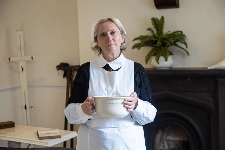 Margaret the Matron character in traditional dress at the National Slate Museum